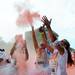 Runners throw pink powder into the air as they participate in the Ypsilanti Color Run 5K on Sunday morning. Melanie Maxwell I AnnArbor.com